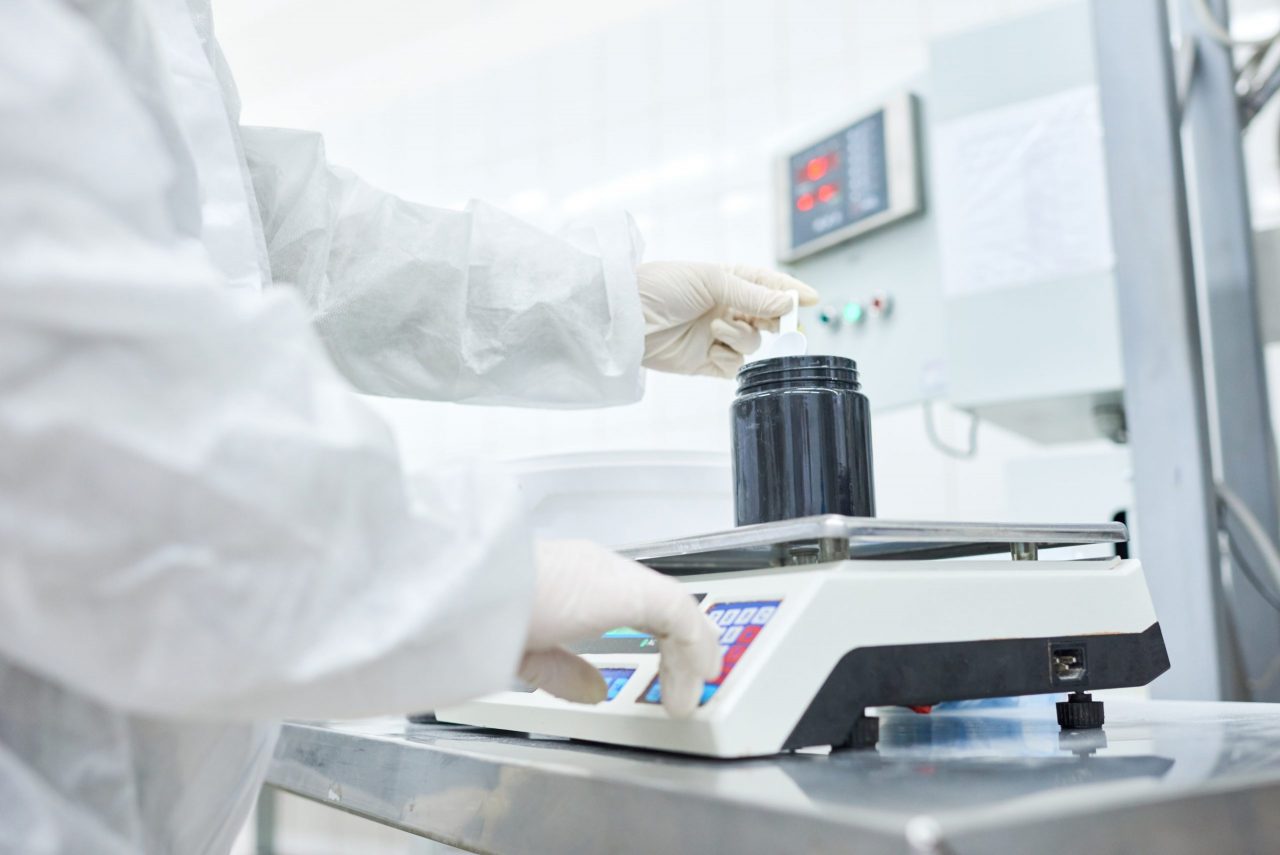factory-worker-weighing-plastic-container-SEMALWU-scaled-1280x855.jpg
