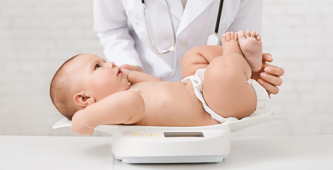 female-doctor-weighting-cute-baby-in-clinic-2021-08-26-16-33-01-utc-scaled-1280x655.jpg